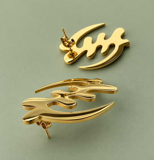 Pair of gold Gye Nyame stud earrings on a sage-green background