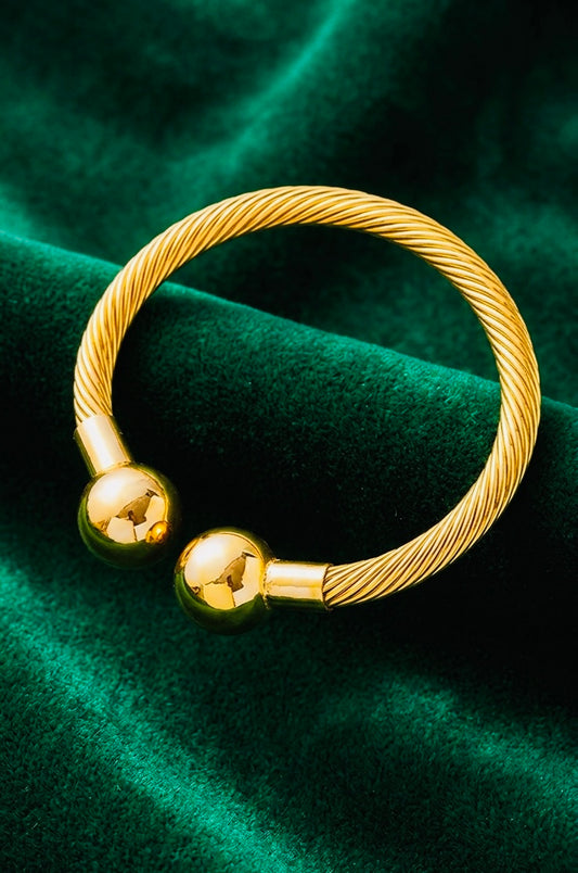 Adjustable twisted gold-plated stainless steel cuff bangle