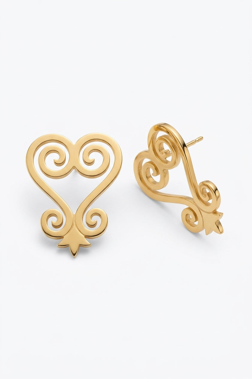 Front and angled views of gold Sankofa swirl stud earrings on white